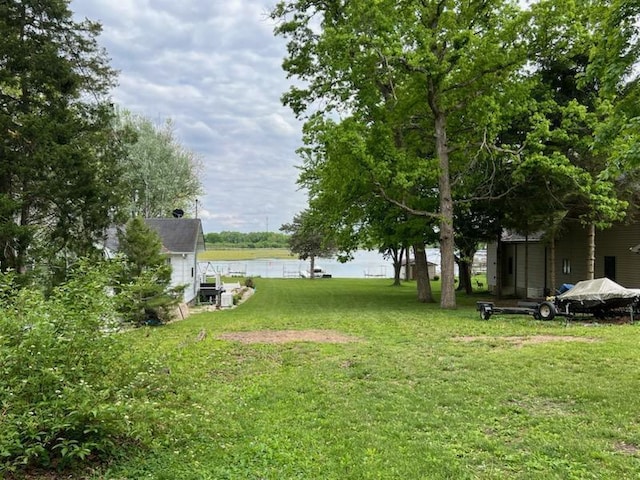 233 Inlet Shores Dr, Delavan, WI 53115 - view of green lawn featuring a water view