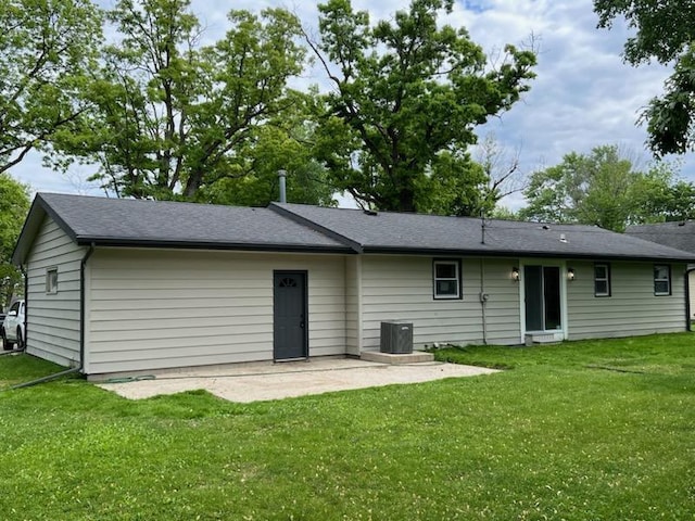 233 Inlet Shores Dr, Delavan, WI 53115 - back of property featuring a patio area, a lawn, and central air condition unit