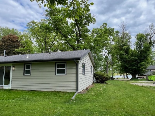 233 Inlet Shores Dr, Delavan, WI 53115 - view of home's exterior with a yard and a shingled roof