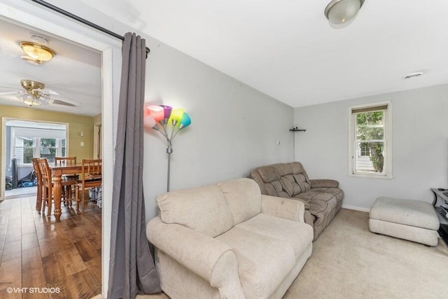 2605 Cameron St, Delavan, WI 53115 - living room featuring a ceiling fan, wood finished floors, and baseboards