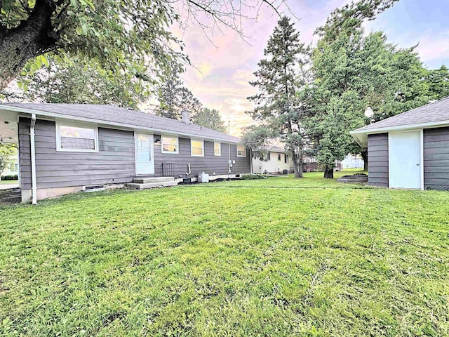 722 Michigan Ave, North Fond Du Lac, WI 54937 - rear view of property featuring a yard