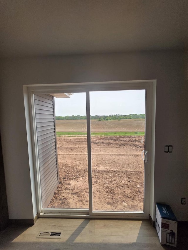 2041 White Dove Ln, Kaukauna, WI 54130 - doorway featuring baseboards and a view of rural / pastoral area