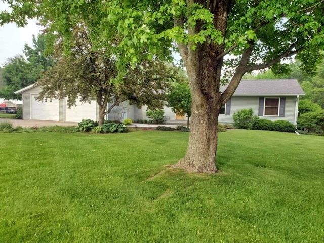 9350 County Road F, Milladore, WI 54454 - view of green lawn featuring a garage