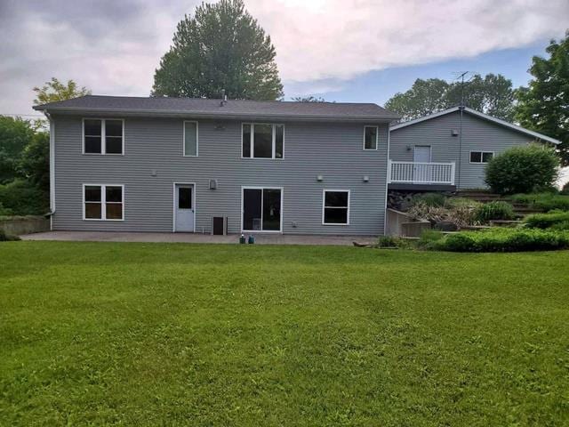 9350 County Road F, Milladore, WI 54454 - rear view of property with a patio and a lawn