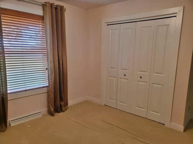 9350 County Road F, Milladore, WI 54454 - unfurnished bedroom featuring light carpet, a closet, and baseboards