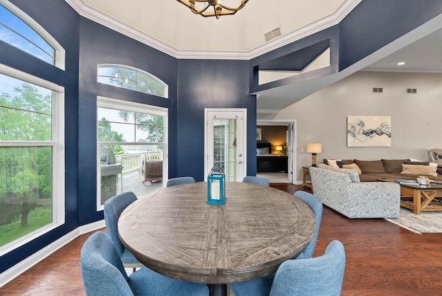 102 Abbey Ridge Ct Unit 102, Fontana, WI 53125 - dining room with a towering ceiling, wood finished floors, a chandelier, baseboards, and recessed lighting