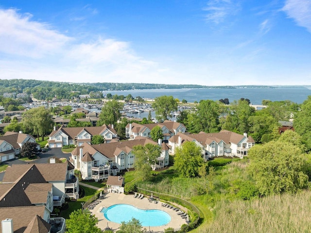 102 Abbey Ridge Ct Unit 102, Fontana, WI 53125 - drone / aerial view of a pool and a nearby body of water