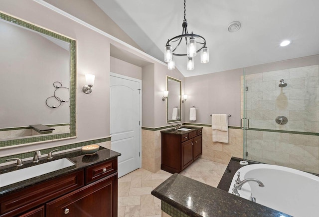 102 Abbey Ridge Ct Unit 102, Fontana, WI 53125 - full bath with vaulted ceiling, tile walls, a stall shower, a chandelier, and two vanities