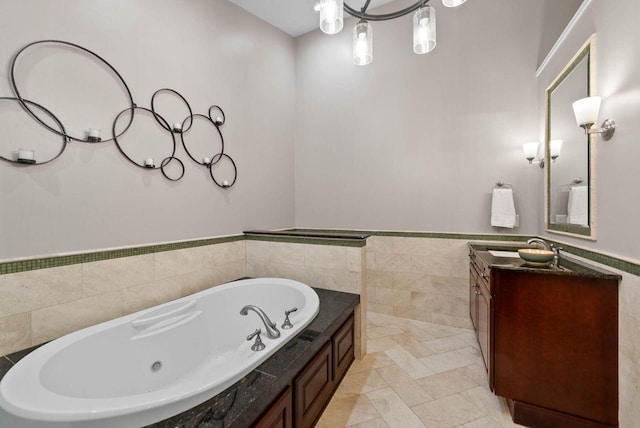 102 Abbey Ridge Ct Unit 102, Fontana, WI 53125 - full bathroom with vanity, tile walls, a tub with jets, and a wainscoted wall