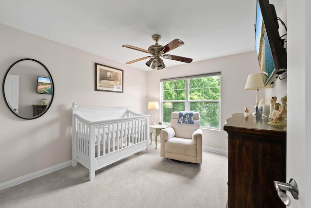 102 Abbey Ridge Ct Unit 102, Fontana, WI 53125 - carpeted bedroom with baseboards, a nursery area, and ceiling fan