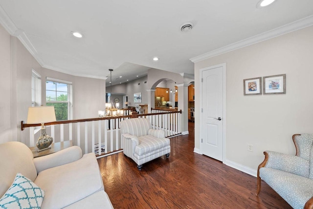 102 Abbey Ridge Ct Unit 102, Fontana, WI 53125 - living area with arched walkways, ornate columns, ornamental molding, wood finished floors, and baseboards