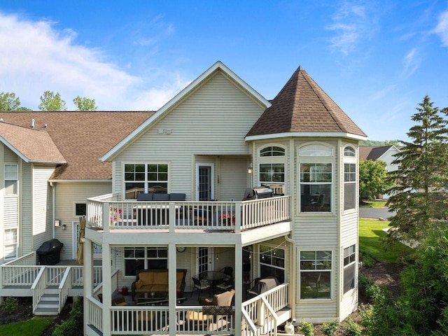 102 Abbey Ridge Ct Unit 102, Fontana, WI 53125 - rear view of house featuring a wooden deck and roof with shingles