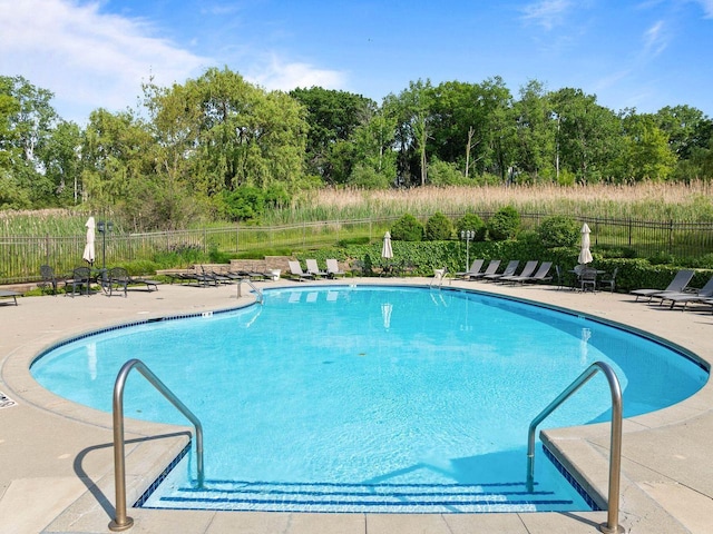 102 Abbey Ridge Ct Unit 102, Fontana, WI 53125 - community pool featuring a patio area