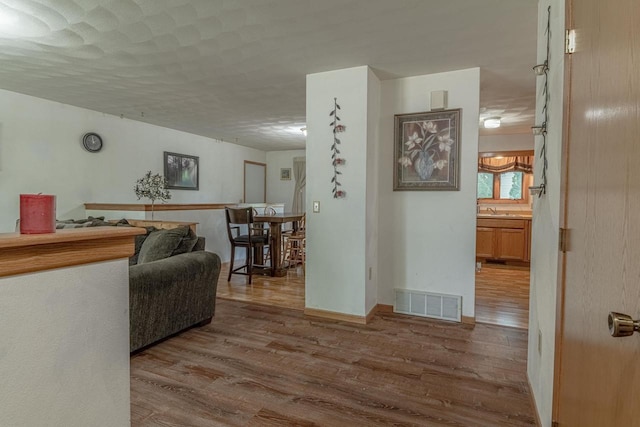 119 N 12th Ave, Monroe, WI 53566 - living area featuring wood finished floors and baseboards