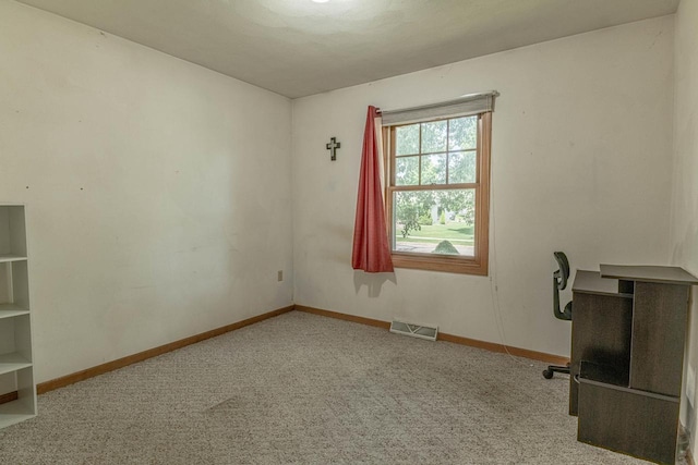 119 N 12th Ave, Monroe, WI 53566 - unfurnished office featuring carpet flooring and baseboards