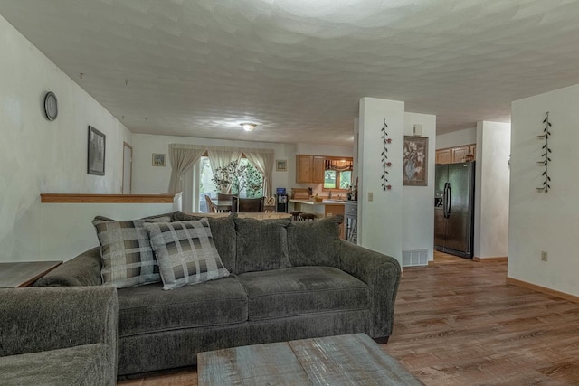 119 N 12th Ave, Monroe, WI 53566 - living room with light wood-style flooring and baseboards