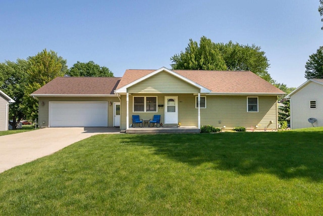 1390 21st St, Hazel Green, WI 53811 - single story home featuring a garage, concrete driveway, a front yard, and a porch