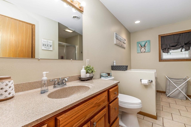 1390 21st St, Hazel Green, WI 53811 - bathroom with tile patterned floors, vanity, toilet, an enclosed shower, and baseboards