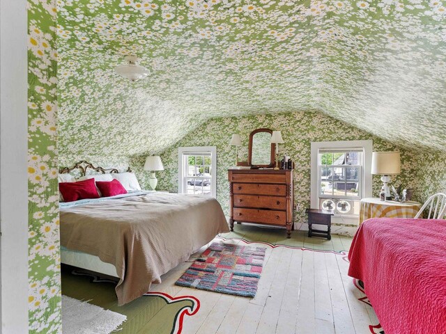 8090 State Highway 57, Baileys Harbor, WI 54202 - bedroom featuring wallpapered walls, hardwood / wood-style flooring, and lofted ceiling