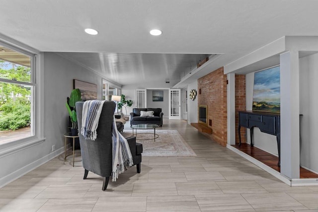4080 Windermere Ln, Oshkosh, WI 54902 - living area featuring baseboards, healthy amount of natural light, a fireplace, and recessed lighting