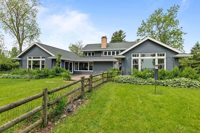 4080 Windermere Ln, Oshkosh, WI 54902 - rear view of house with a chimney