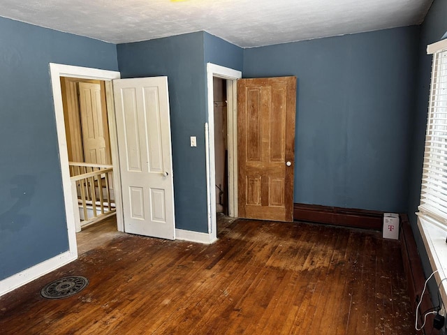 432 W Capitol Dr, Hartland, WI 53029 - unfurnished bedroom with wood-type flooring and baseboards