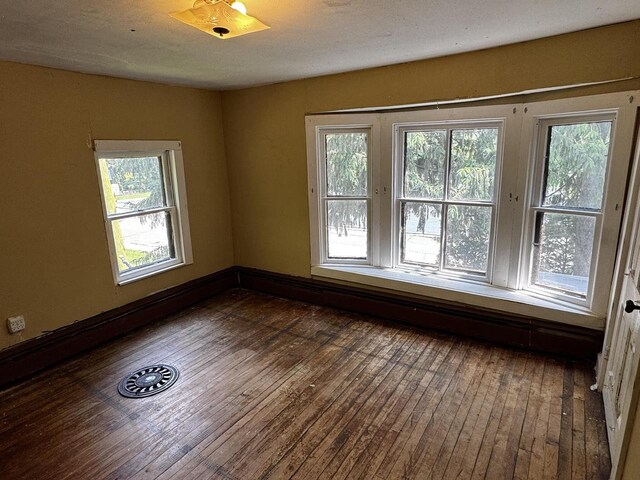 432 W Capitol Dr, Hartland, WI 53029 - spare room featuring dark wood finished floors and plenty of natural light