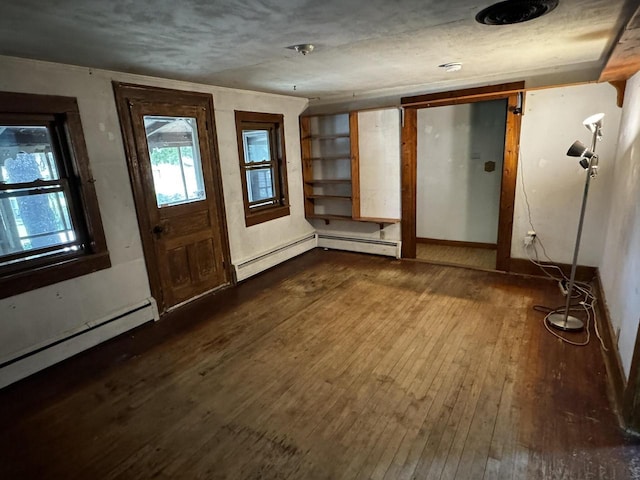 432 W Capitol Dr, Hartland, WI 53029 - foyer featuring dark wood-style flooring, a baseboard heating unit, and baseboards
