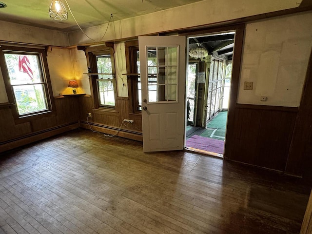 432 W Capitol Dr, Hartland, WI 53029 - foyer with hardwood / wood-style flooring, wooden walls, wainscoting, and a baseboard heating unit