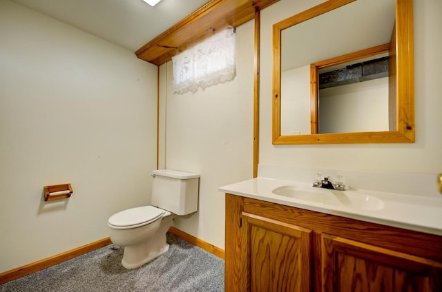 1516 Pierce Ave, Oshkosh, WI 54902 - bathroom featuring toilet, vanity, and baseboards