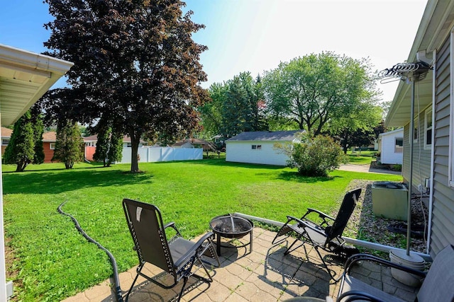 1516 Pierce Ave, Oshkosh, WI 54902 - view of patio / terrace with an outdoor fire pit and central air condition unit