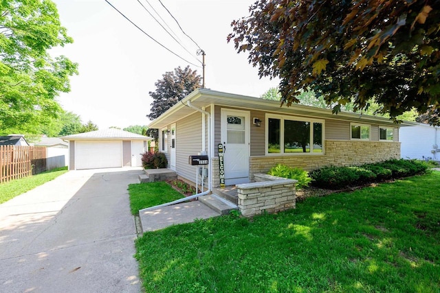 1516 Pierce Ave, Oshkosh, WI 54902 - ranch-style home with an outdoor structure, a detached garage, and stone siding