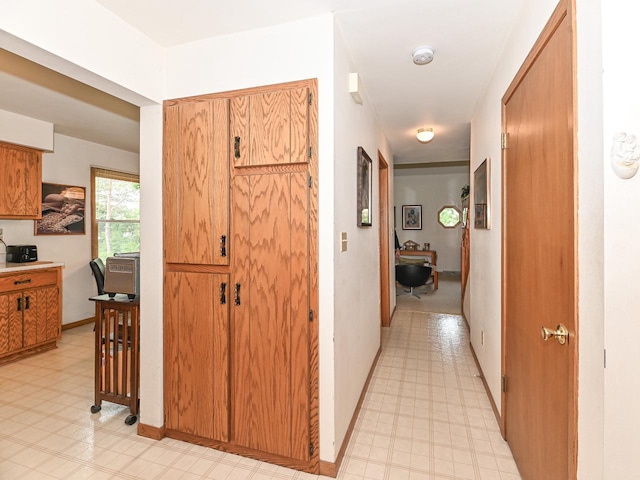 2016 Madera St Unit 2018, Waukesha, WI 53189 - corridor featuring an office area, light floors, and baseboards