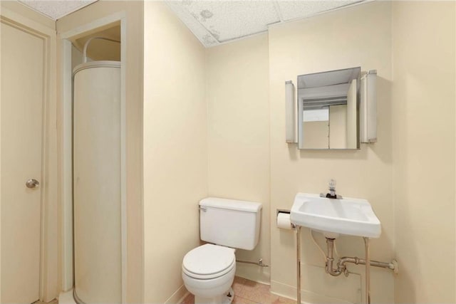 1711 Olive St, Stillwater, MN 55082 - bathroom featuring toilet, baseboards, and tile patterned floors
