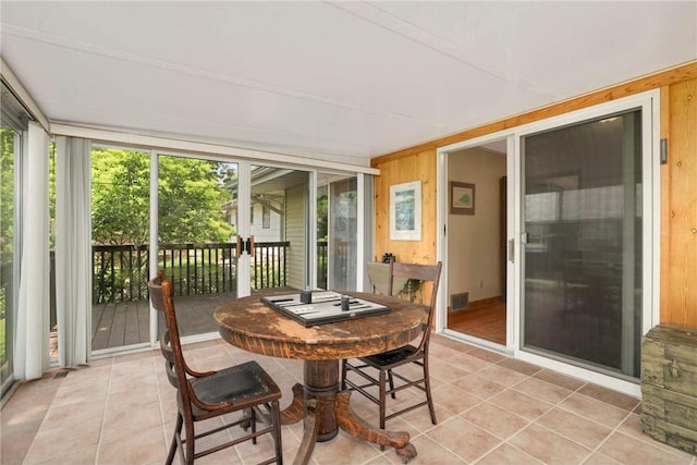 1711 Olive St, Stillwater, MN 55082 - sunroom featuring wooden walls and tile patterned floors