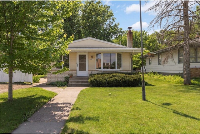 1711 Olive St, Stillwater, MN 55082 - bungalow-style house featuring a front lawn and a chimney