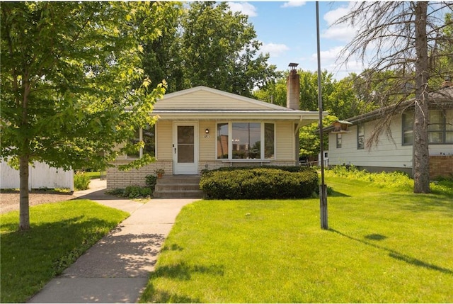1711 Olive St, Stillwater, MN 55082 - bungalow-style house featuring a front yard and a chimney
