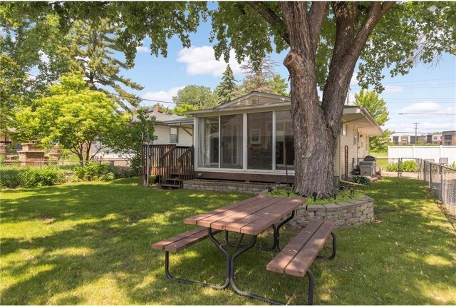 1711 Olive St, Stillwater, MN 55082 - rear view of house featuring a sunroom