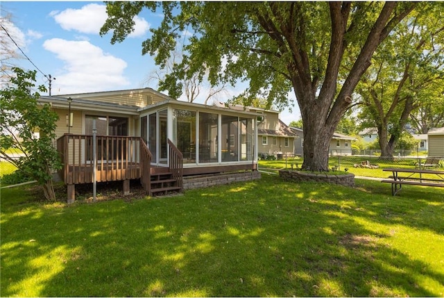 1711 Olive St, Stillwater, MN 55082 - rear view of house with a sunroom and a deck