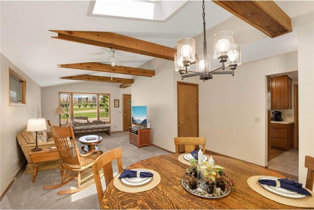 1711 Olive St, Stillwater, MN 55082 - dining room with light carpet, a skylight, a chandelier, baseboards, and ceiling fan
