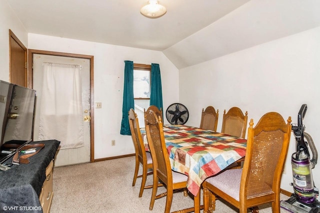 314 E Maple Ave, Beaver Dam, WI 53916 - dining area featuring light colored carpet, vaulted ceiling, and baseboards
