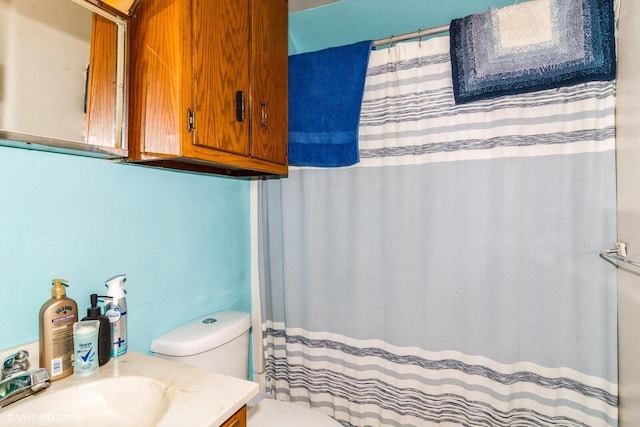 314 E Maple Ave, Beaver Dam, WI 53916 - bathroom featuring toilet, vanity, and curtained shower