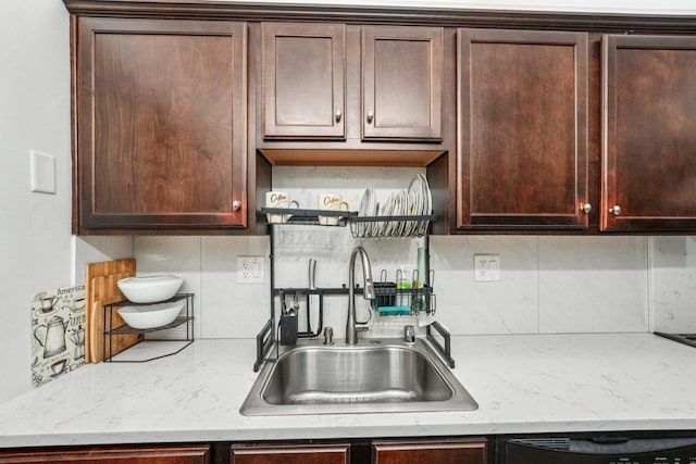 2350 Good Hope Rd Unit 156, Glendale, WI 53209 - kitchen featuring a sink, dark brown cabinetry, black dishwasher, and tasteful backsplash