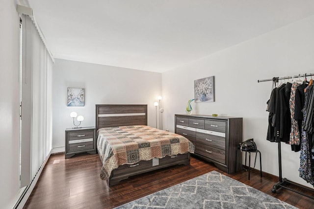 2350 Good Hope Rd Unit 156, Glendale, WI 53209 - bedroom featuring dark wood-style flooring, a baseboard radiator, and baseboards