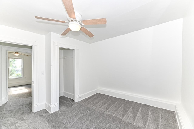 1443 Summit Ave, Racine, WI 53404 - unfurnished bedroom with dark colored carpet, a closet, and a ceiling fan