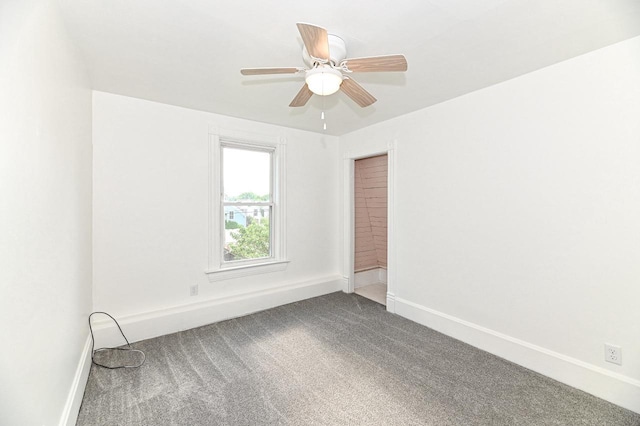 1443 Summit Ave, Racine, WI 53404 - empty room featuring dark colored carpet and ceiling fan