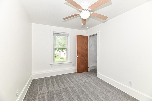 1443 Summit Ave, Racine, WI 53404 - carpeted spare room with baseboards and a ceiling fan