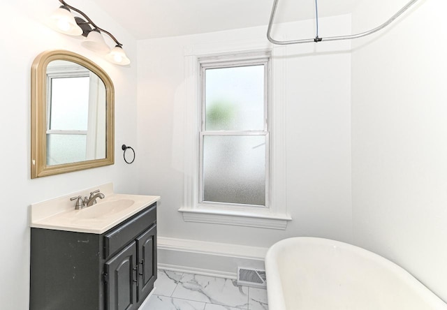 1443 Summit Ave, Racine, WI 53404 - bathroom with marble finish floors, a soaking tub, and vanity