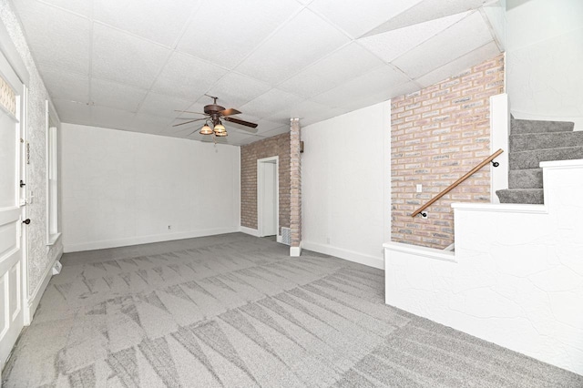 1443 Summit Ave, Racine, WI 53404 - unfurnished living room with ceiling fan, carpet, stairway, and a drop ceiling