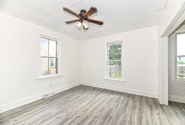 1443 Summit Ave, Racine, WI 53404 - empty room with wood finished floors and ceiling fan